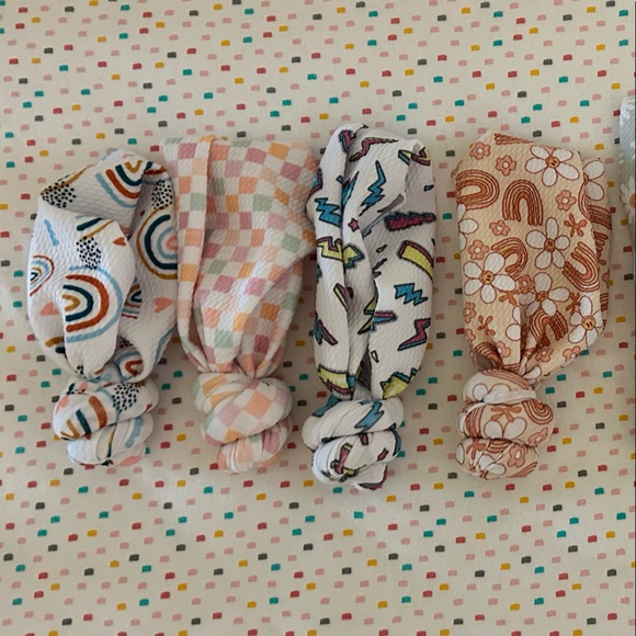 Newborn size top knots. Never worn!